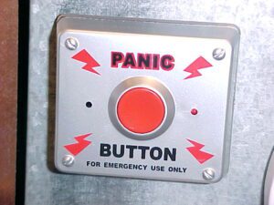 Red panic button inside a Bengaluru city cab placed beside the driver’s dashboard for emergencies.