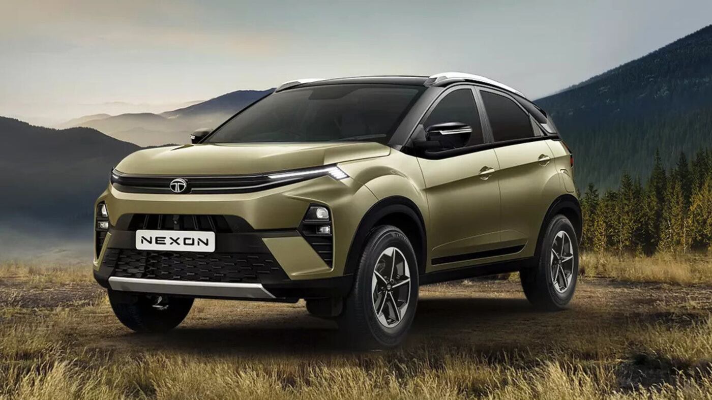 Tata Nexon 2025 compact SUV in Royale Blue with connected LED DRLs, new grille, and bold alloy wheel