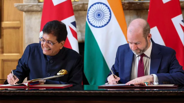 Indian and UK officials sign historic Free Trade Agreement in front of national flags
