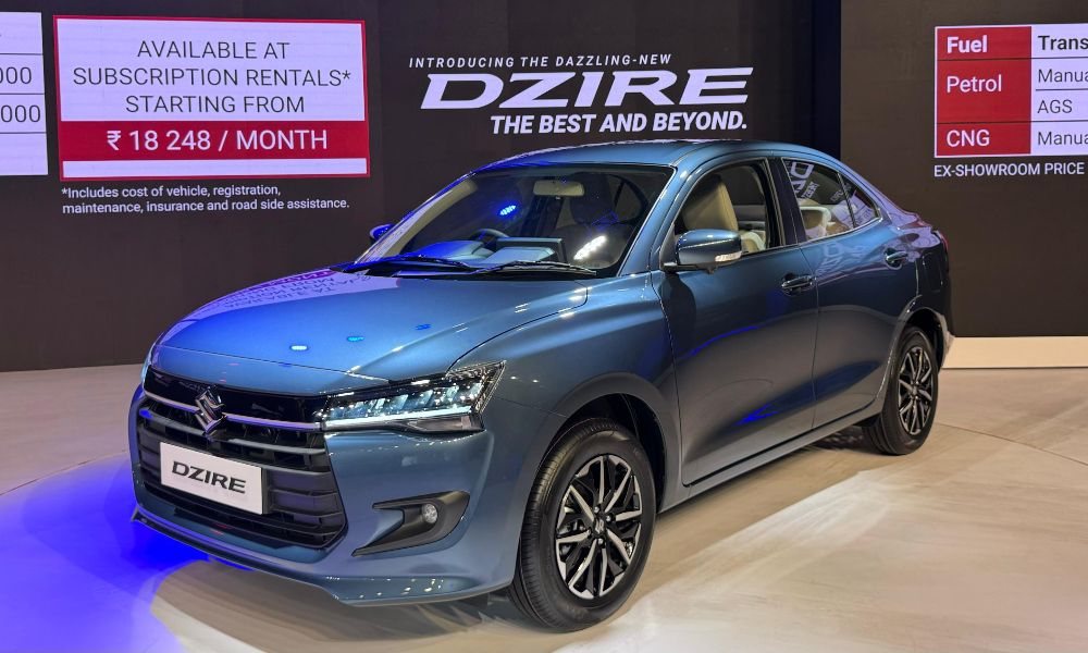Front-side view of the 2025 Maruti Suzuki Dzire with refreshed styling, LED lights, and alloy wheels