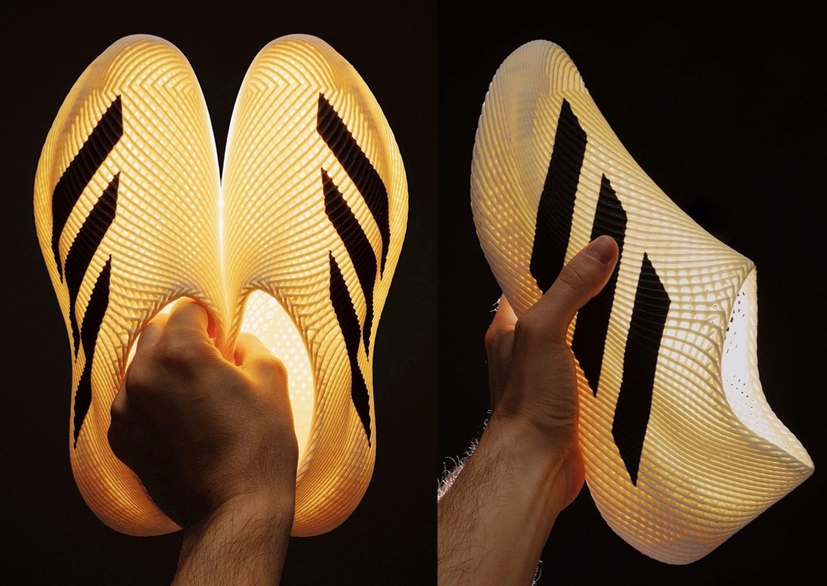 Laced Adidas 4DFWD sneakers with 3D-printed midsoles and breathable mesh upper.