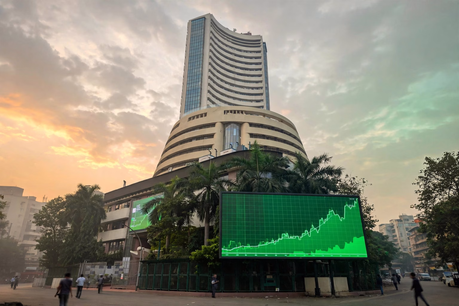 Sensex Jumps Nearly 800 Points, Nifty Tops 22,450 as Markets Rebound From 32-Month Low Bombay Stock Exchange building in Mumbai with rising market charts on a digital board